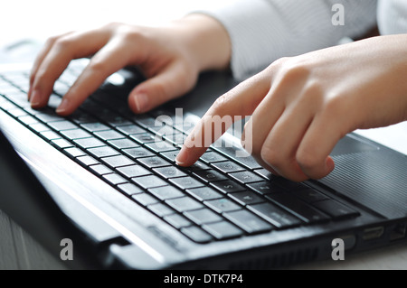Close-up of typing female hands on keyboard Stock Photo
