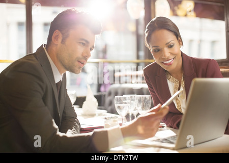 Business people working in restaurant Stock Photo