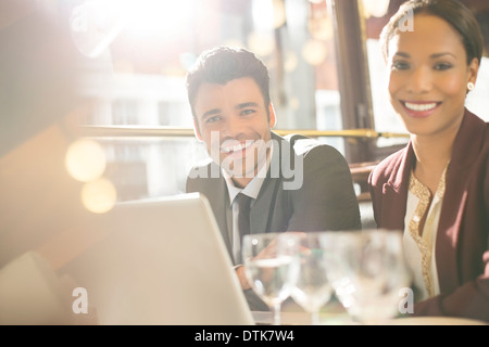 Business people smiling in restaurant Stock Photo