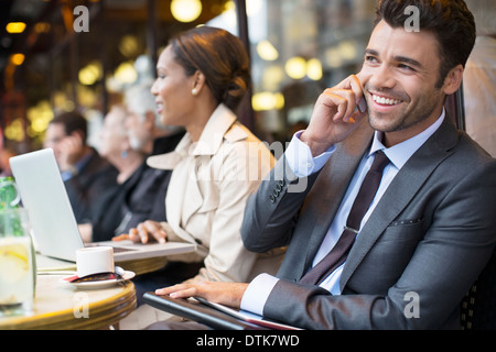 Business people working at sidewalk cafe Stock Photo