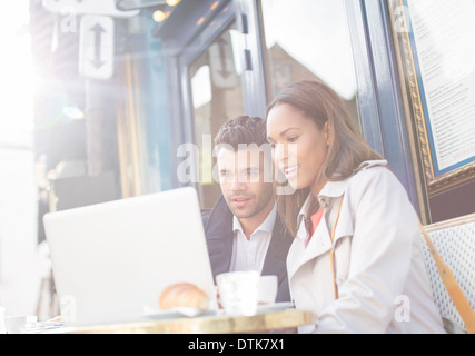 Business people working in sidewalk cafe Stock Photo
