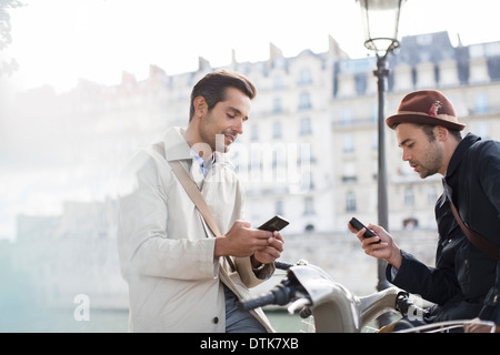 Businessmen using cell phones Stock Photo