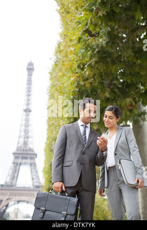 Business people talking near Eiffel Tower, Paris, France Stock Photo