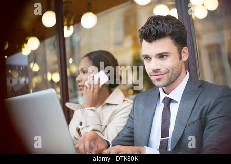 Business people working at sidewalk cafe Stock Photo