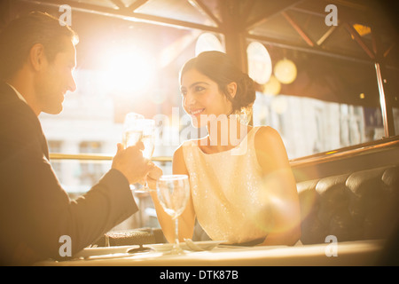 Couple toasting champagne flutes in restaurant Stock Photo