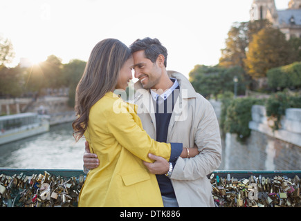 Couple hugging on Pont des Arts, Paris, France Stock Photo