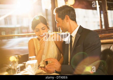 Man proposing to girlfriend in restaurant Stock Photo