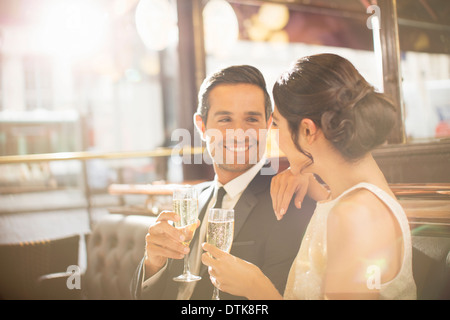 Couple drinking champagne in restaurant Stock Photo