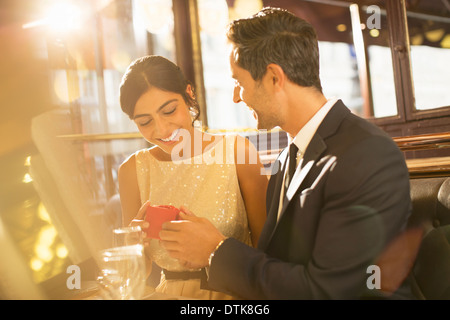 Man proposing to girlfriend in restaurant Stock Photo