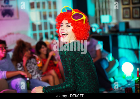 Woman wearing wig and oversized sunglasses Stock Photo