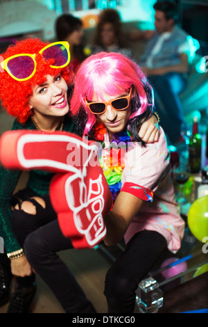 Couple wearing costumes at party Stock Photo