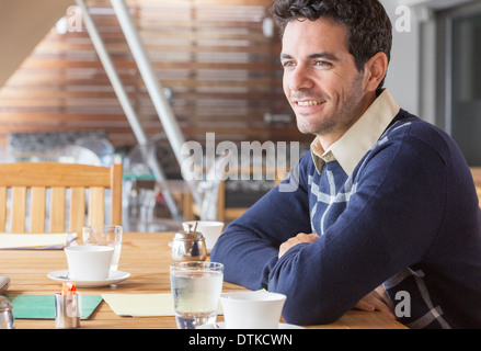 Businessman smiling in meeting Stock Photo