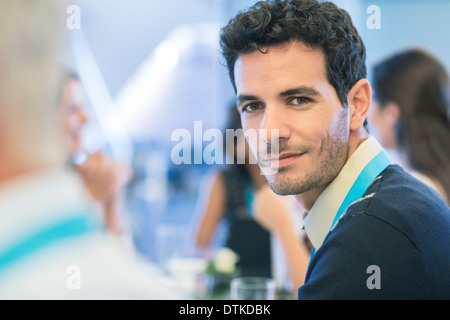 Businessman smiling in meeting Stock Photo