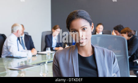 Business woman sitting in meeting Stock Photo