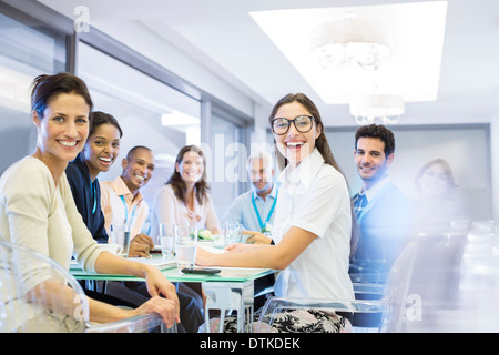 Business people smiling in meeting Stock Photo