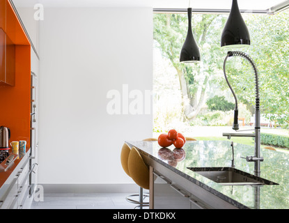Wall art and counters in modern kitchen Stock Photo
