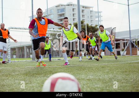 Soccer players training on field Stock Photo