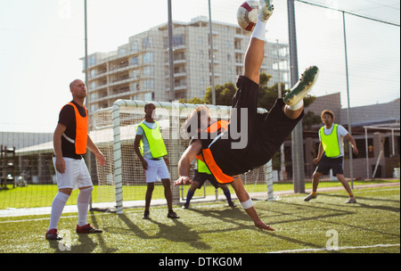 Soccer players training on field Stock Photo