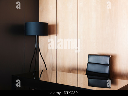 Desk and lamp in modern office Stock Photo