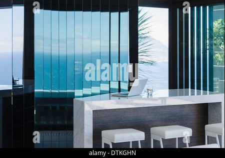 Stools and counter in modern house Stock Photo