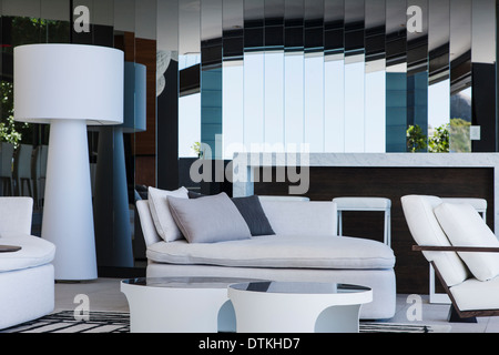 Sofa and mirrors in modern living room Stock Photo