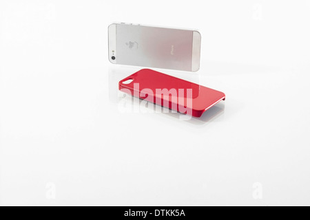iPhone brand mobile phones and red cover Stock Photo