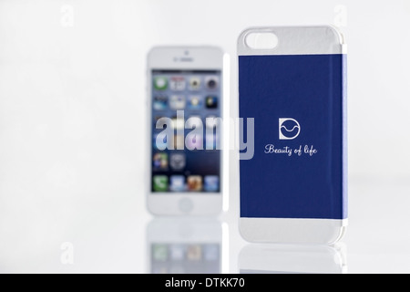 stylish mobile phone and its bright blue cover Stock Photo