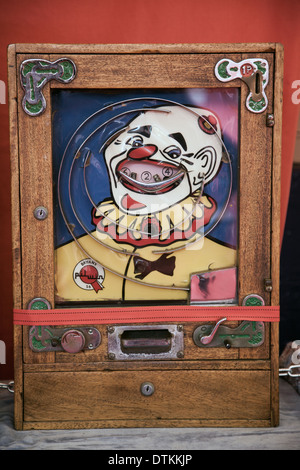 Bryans vintage ALLWIN arcade slot machine  1p Antique  'Clown faced' Slot Machine on Stand. Stock Photo