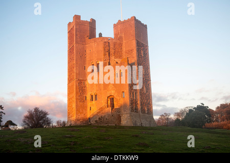 Late afternoon winter sunshine shining on walls of Orford Castle, Orford, Suffolk, England Stock Photo