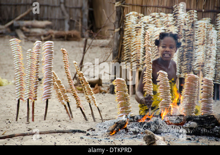 Madagascar, Morondava, Kimoni, local woman cooking grilled fish in high quantity Stock Photo