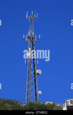 global communication tower with cell phone antenna Stock Photo