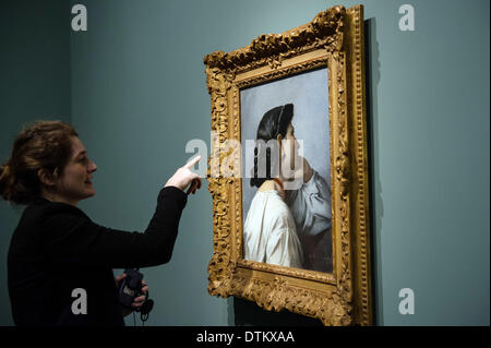 Hamburg, Germany. 20th Feb, 2014. A woman looks at Anselm Feuerbach's 'Study of head for the Stuttgart Iphigenia', 1870, oil on canvan, in the exhibition 'Feuerbach's Muses - Lagerfeld's Models' in the Kunsthalle in Hamburg, Germany, 20 February 2014. The exhibition compares the neo-classical paintings of Anselm Feuerbach (1829-1880) and the photographs of fasion designer Karl Lagerfeld. Photo: MAJA HITIJ/dpa/Alamy Live News Stock Photo