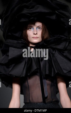 A model wears a design created by John Rocha during London Fashion Week Autumn/Winter 2014, at Somerset House. Stock Photo