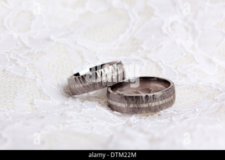 Pair of wedding rings on white lace Stock Photo