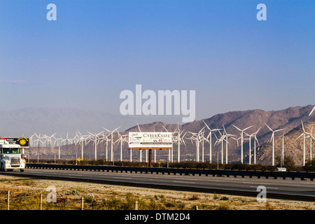 Wind farm along Interstate 10 in the Palm Springs area of California with a billboard advertising plastic surgery Stock Photo