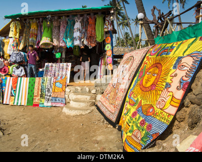 India, Goa, Vagator Beach, textile stall, selling, clothes, sarongs and mats Stock Photo