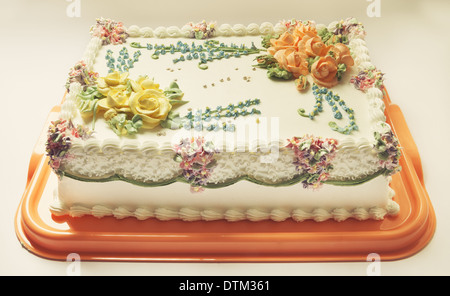 Classical birthday cake design with a lot of flowers of cream Stock Photo -  Alamy