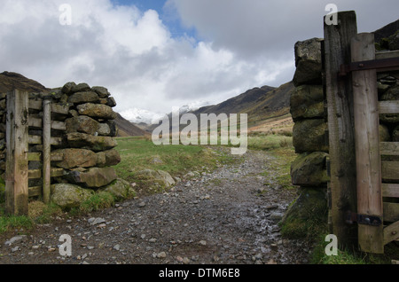 A field gate in a dry stone wall in Eskdale, Lake District, England Stock Photo