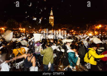 Pillow talk replaced by pillow fight by thousands having fun on Valentines Day in San Francisco Stock Photo