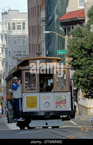 Cable car climbs the hilly streets of San Francisco, California. Stock Photo