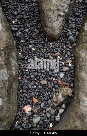 Black pebbles on the beach Stock Photo