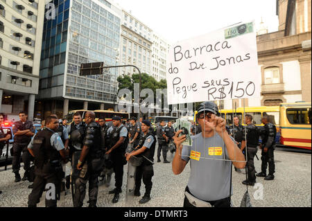 Rio De Janeiro, Brazil. 20th Feb 2014. Concentration of protesters in the square of the church of Candelaria city center of Rio de Janeiro, the manifesto is against abusive increases in buses, trains, subways and ferries. (Photo by Fabio Teixeira/ Pacific Press) Credit:  PACIFIC PRESS/Alamy Live News Stock Photo