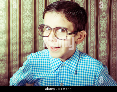 Smiling child with glasses in vintage clothes. Close up shot Stock Photo