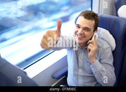 Young successful businessman in the train. Stock Photo
