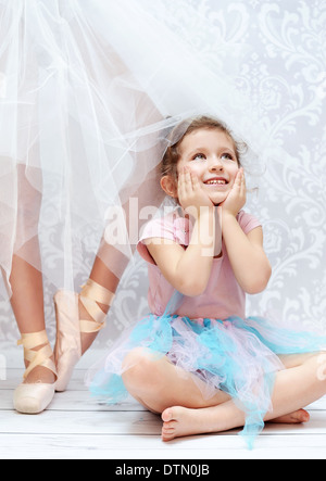 Cute girl next to the ballet dancer sister Stock Photo