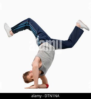 Break dancer doing a hand stand Stock Photo