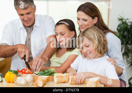 Family making sandwiches Stock Photo