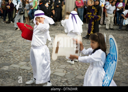 Children participant in procession during Semana Santa (Holy Week) in Antigua, Guatemala. Stock Photo