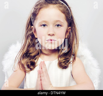 Picture of calm little girl with serious look Stock Photo
