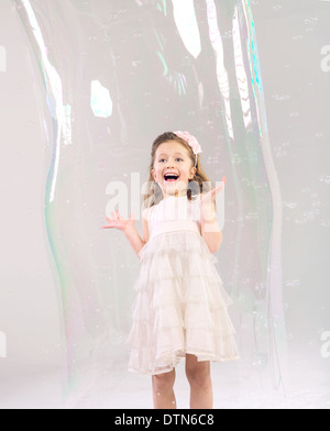 Cute girl in the large soap bubble Stock Photo